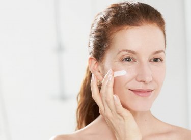 Bioderma - woman applying cream on the face