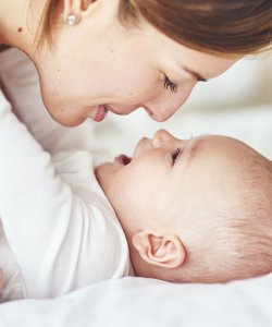 Woman playing with her baby